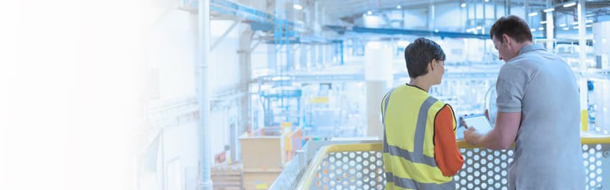 2 men looking at warehouse