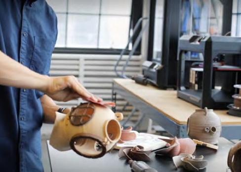 Man sanding newly 3d printed shape