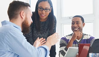 three people having a discussion