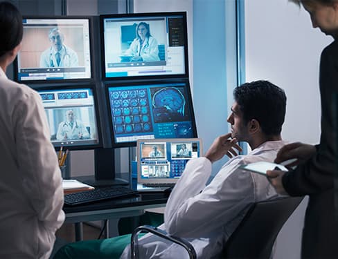 Doctors examining x-rays in video conference