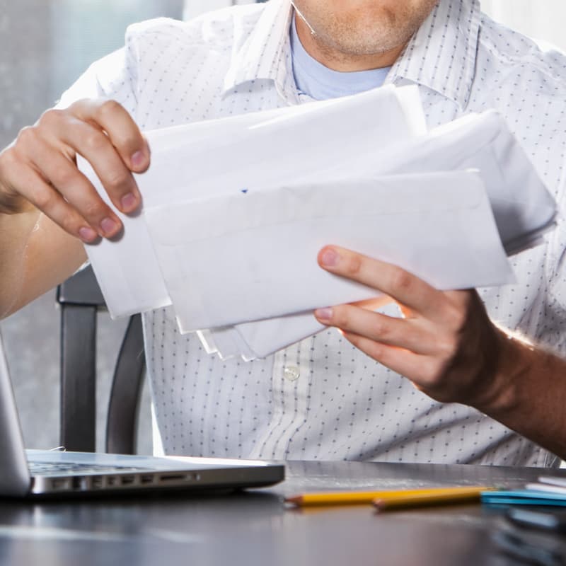man sorting through mail
