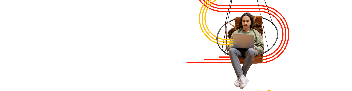 Asian man working on laptop, looking at remanufactured printers supporting efficiency in today’s hybrid and flexible workplaces