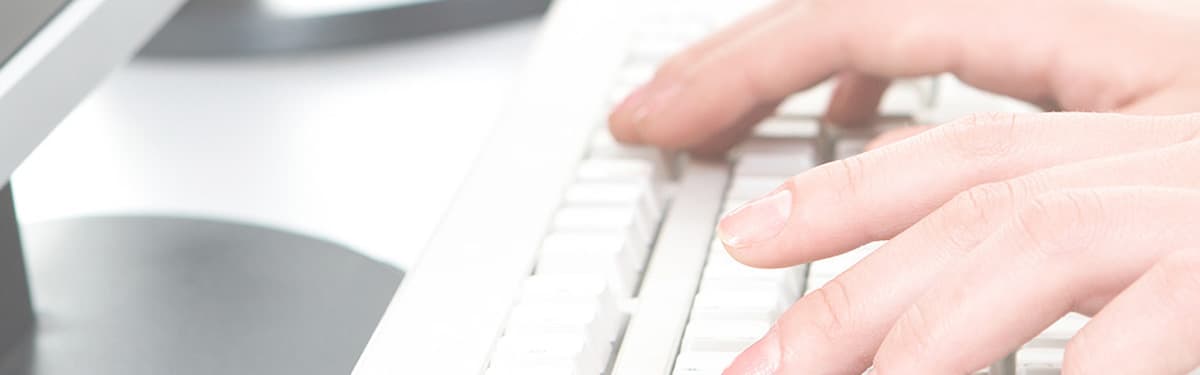 Doctor typing on a keyboard