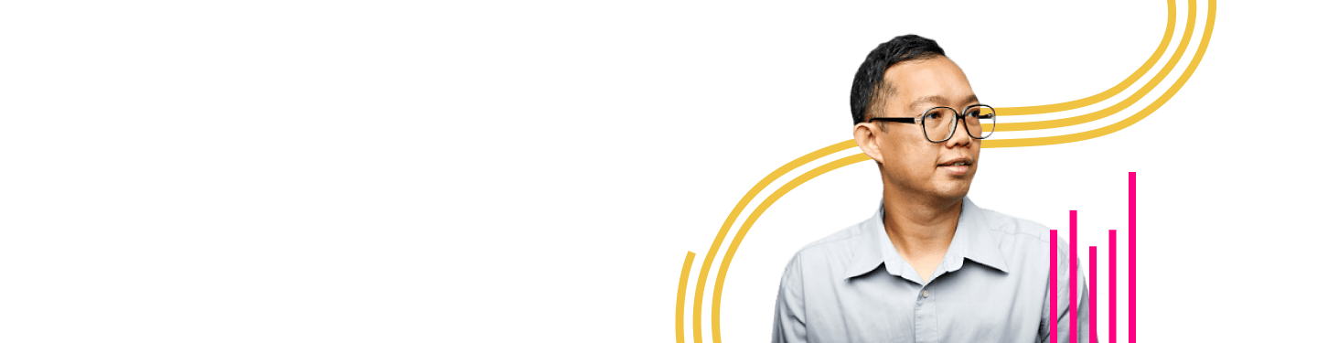 Man wearing a button grey shirt and classes looking to the right